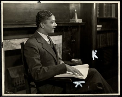 Portrait of blind African American man reading braille at the New York Association for the Blind, 111 East 59th Street, New York, 1935 by Byron Company